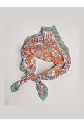 Decorative headscarf with floral pattern on a light gray background