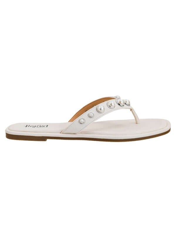 White sandal with pearl embellishments on a white background
