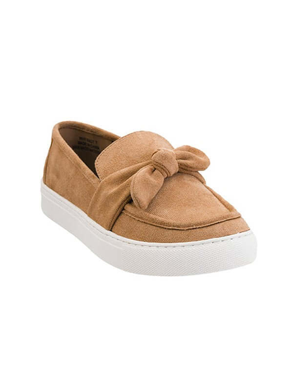 Tan slip-on shoe with a bow detail on a white background
